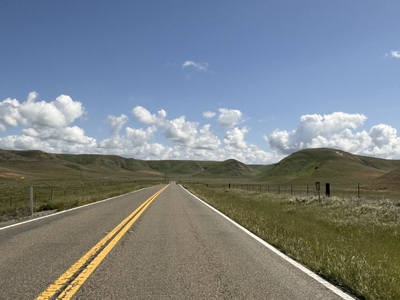 Curvy road through a landscape.