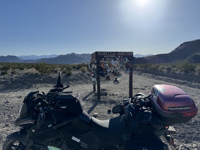 My bike at the Teakettle Junction signpost